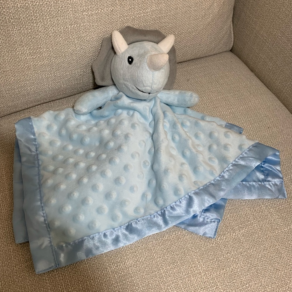 Triceratops baby lovey. Dot fabric for tactile stimulation. Satin back and edge